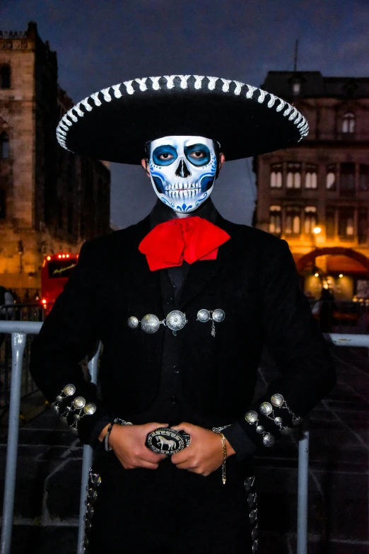 a mexican day of the dead man wearing an interesting hat