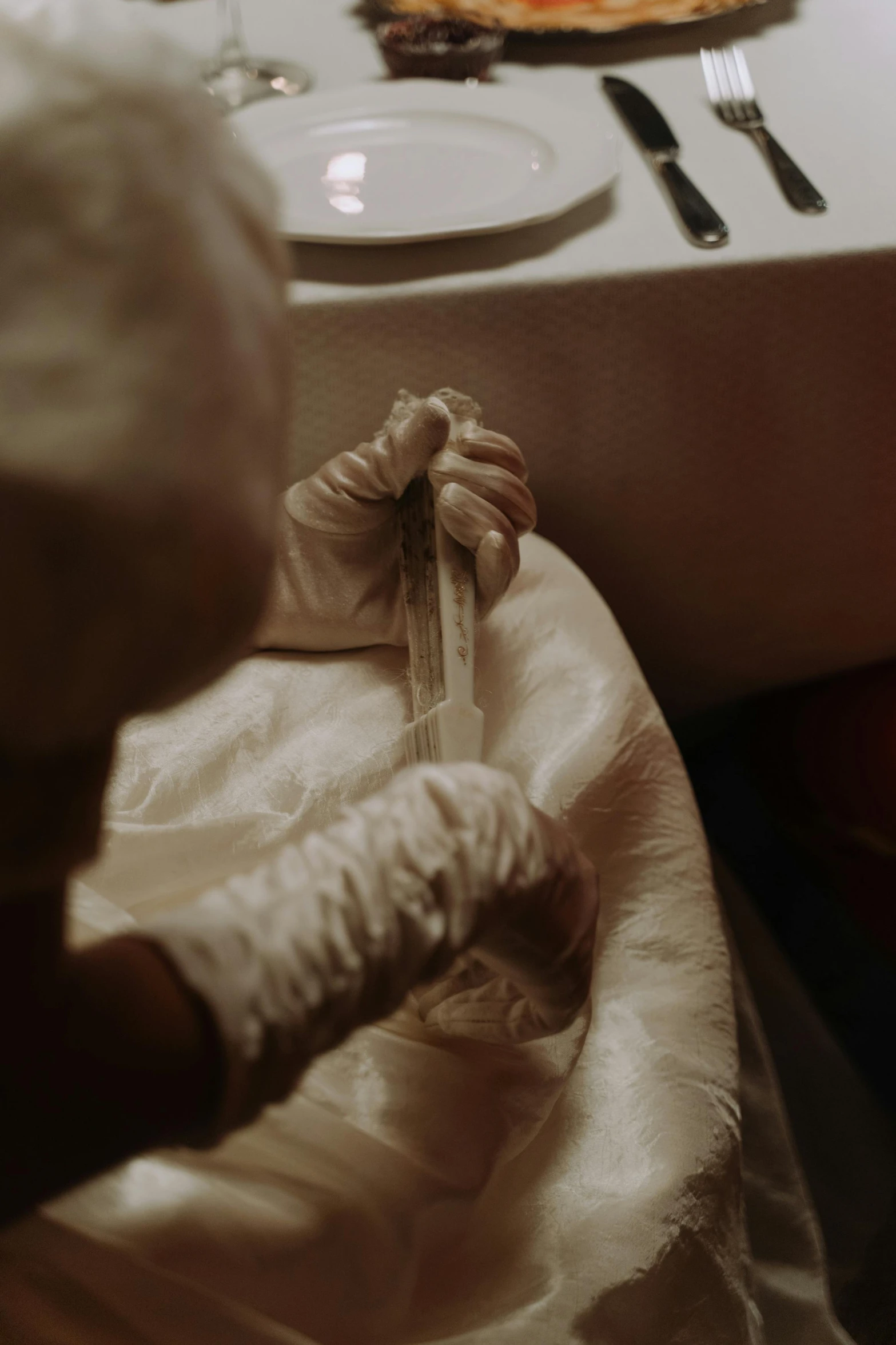 an infant on a chair holding an empty wrapper