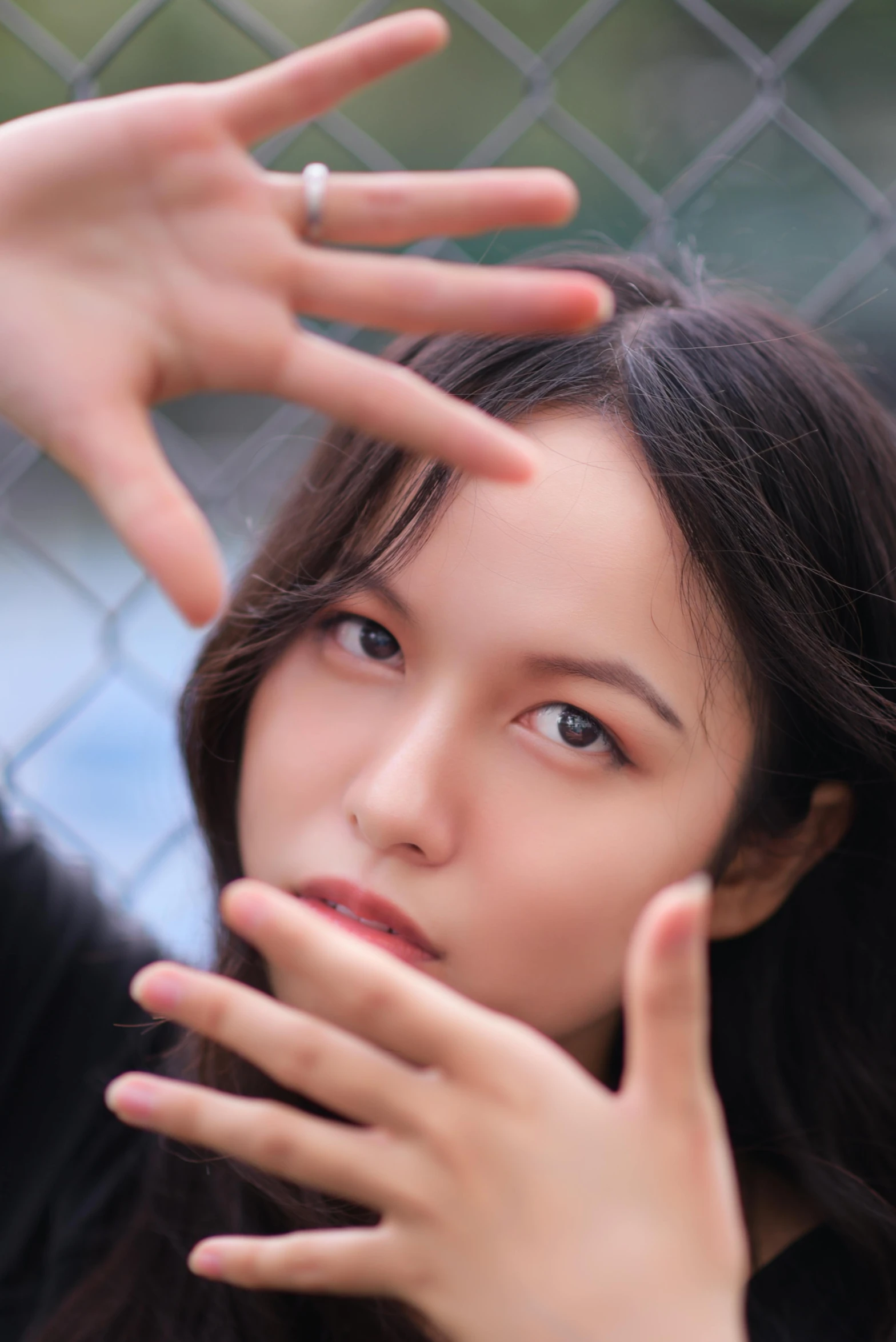 a woman in black top touching her hand