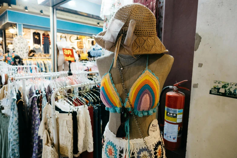 a womans mannequin with a large hat on top of it