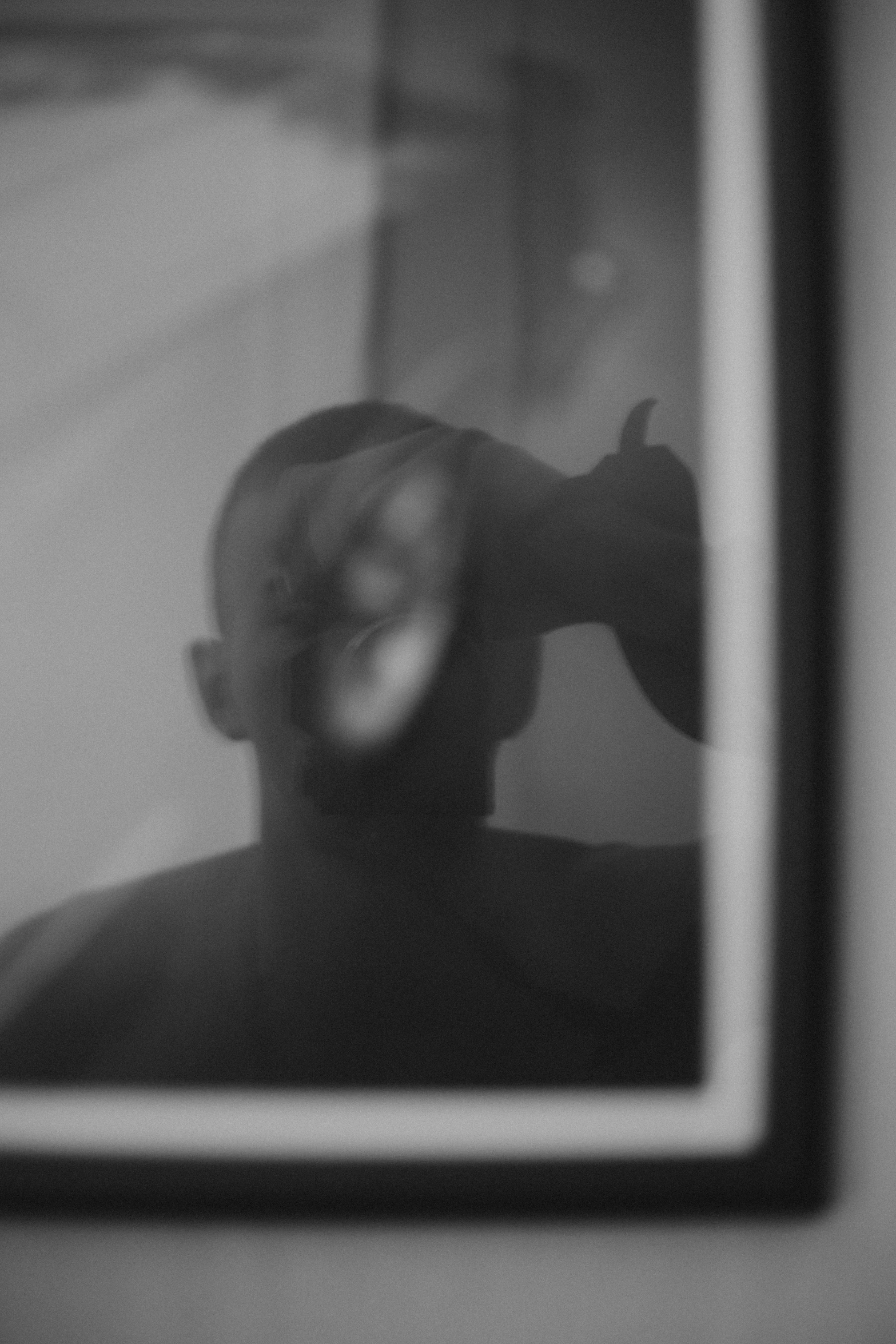 a man in the mirror and his reflection is reflected