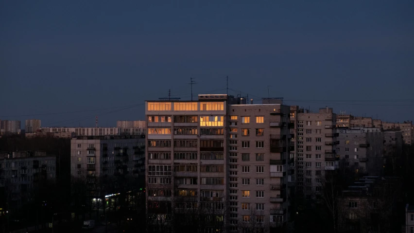 a group of buildings are lit up at night