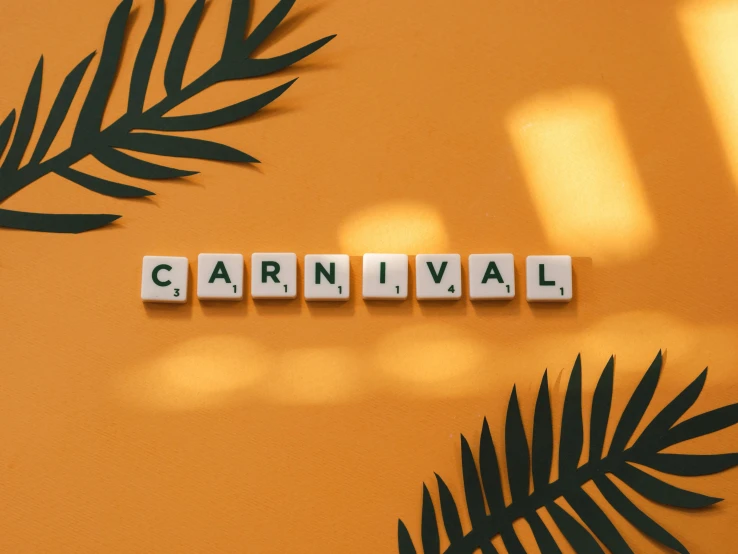 two blocks that spell out the word carnival are sitting on a table