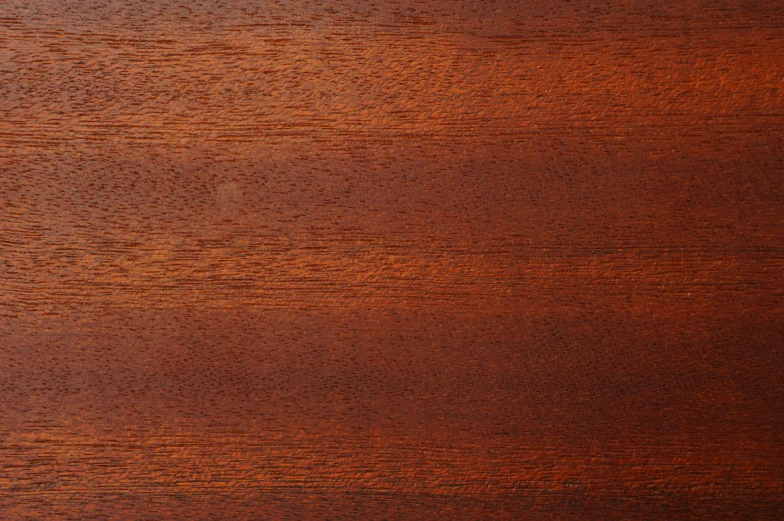 a textured wood grain background with dark stains