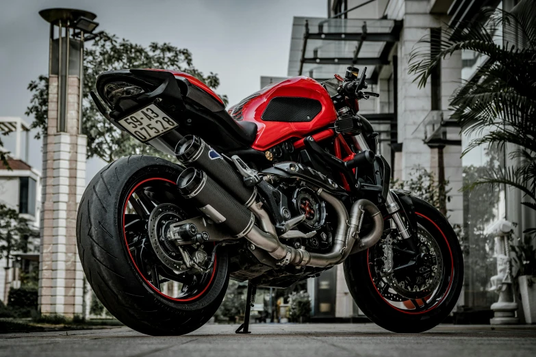 the motorcycle is red and black and black with red accents