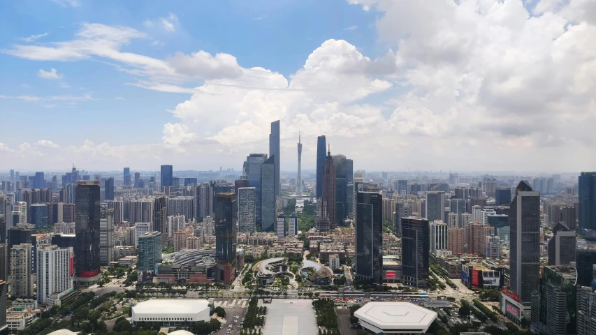 a picture of some buildings and clouds in the sky