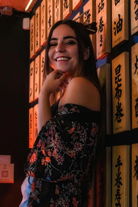 a woman posing for a po in front of books