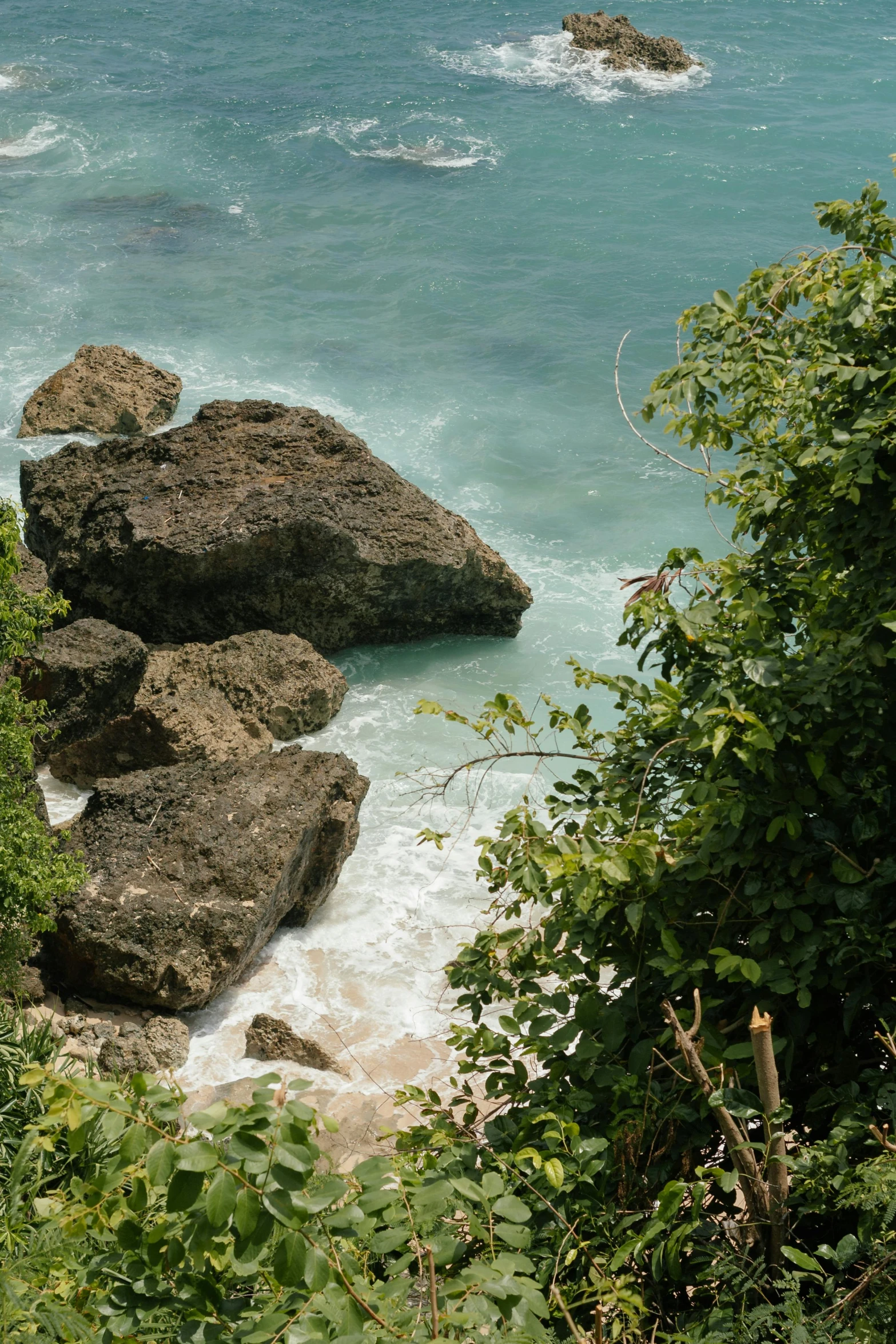 the sea on an island with waves crashing on rocks