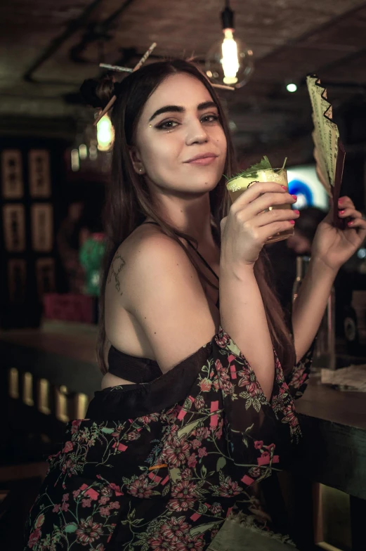 the young woman is posing with her food