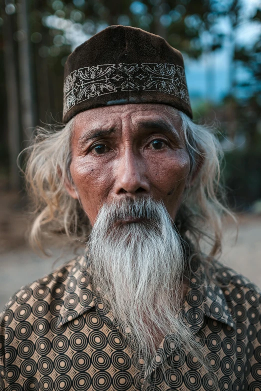 an old man with white beard and mustache