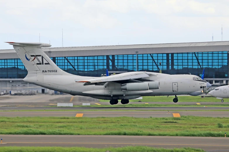 a large air plane taking off from an airport runway