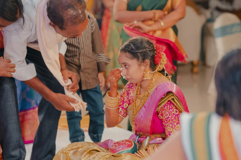 a bride prepares her veil for the wedding ceremony