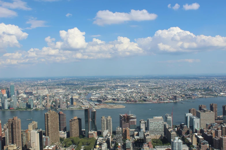 a city filled with tall buildings next to a body of water