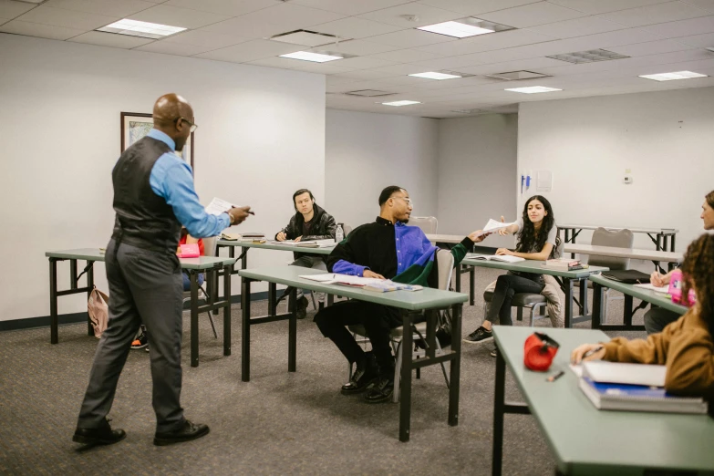 a group of students sitting at desks and studying