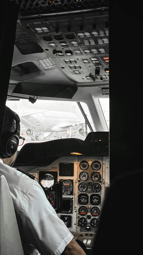 two pilots in the cockpit of an airplane