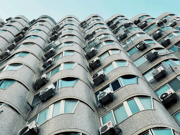 a tall building with multiple windows and balconies