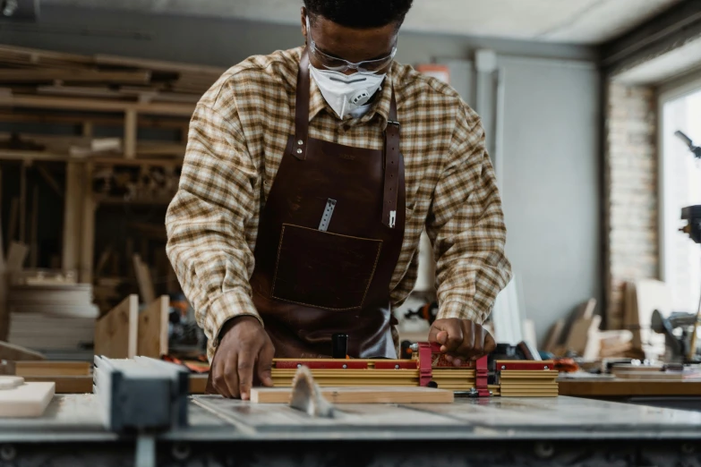 an image of a person working in his art studio