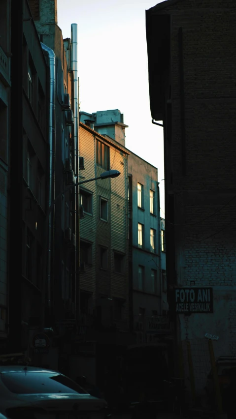 a large brick building in the distance with a clock on it