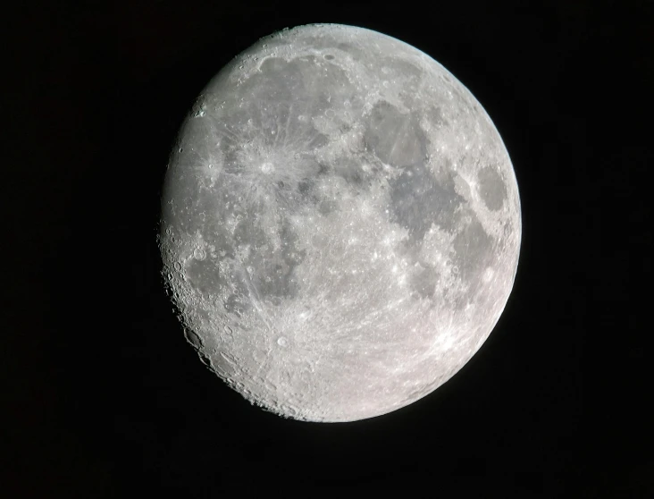 the large full moon is visible during the night