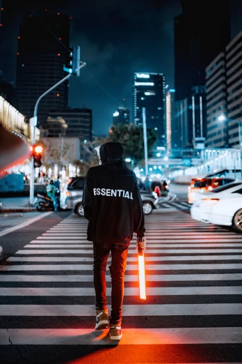 a man walks across an empty city street