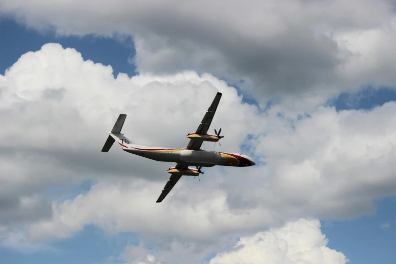 a single engine plane is soaring high in the sky