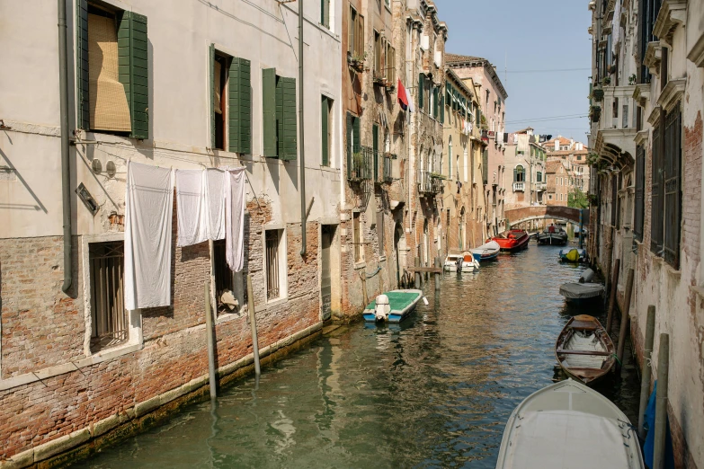 a narrow waterway with many buildings next to it