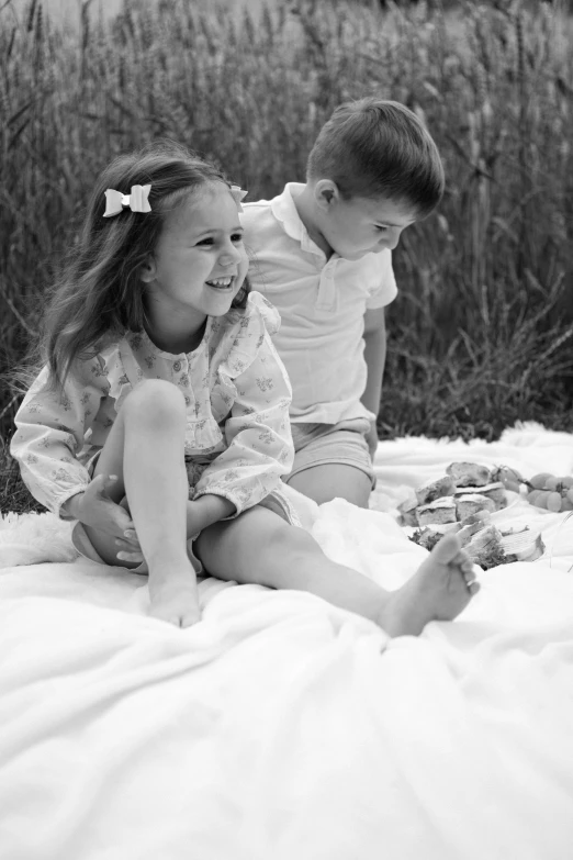 a black and white po of two little girls playing together