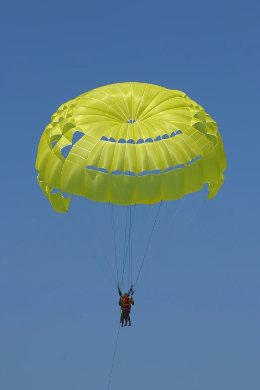 a parachute is shown being flown on a clear day