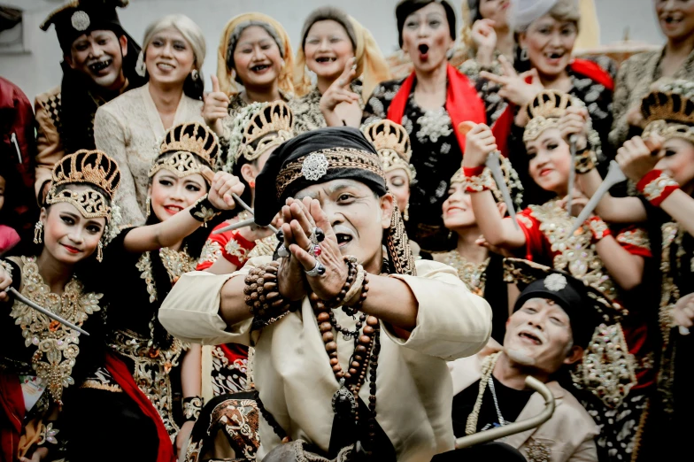 a group of people dressed in costumes and holding soing