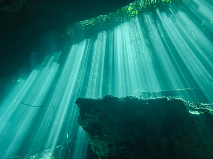 some water that has many light beams in it