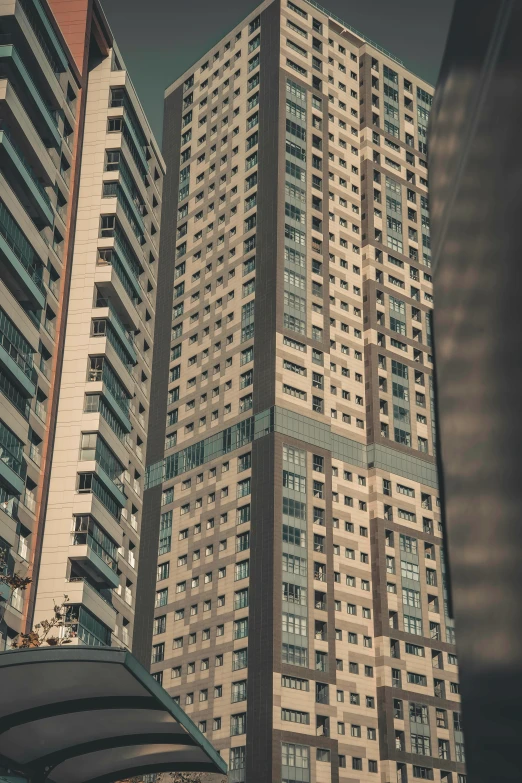 some tall buildings with windows and balconies