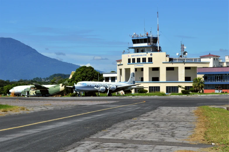 the plane is at the airport on the runway