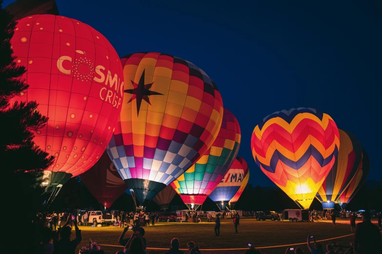 many  air balloons sitting in the sky