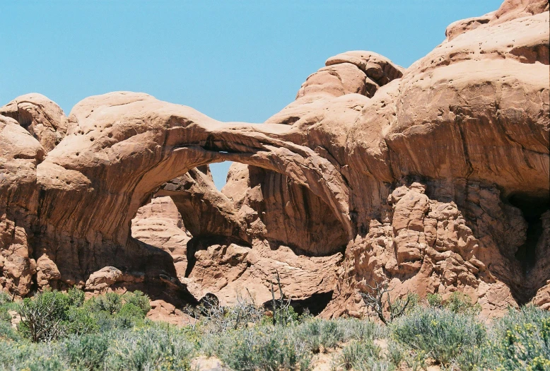 a large rock formation with an arch in it