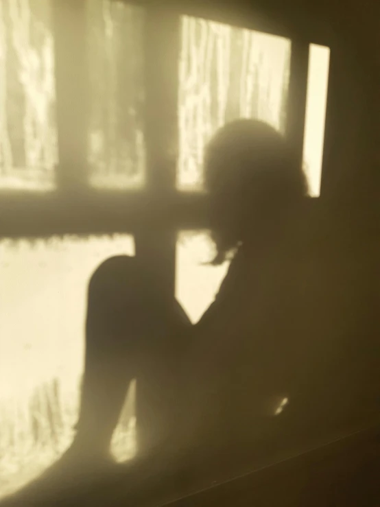 silhouettes of women who are looking out the window