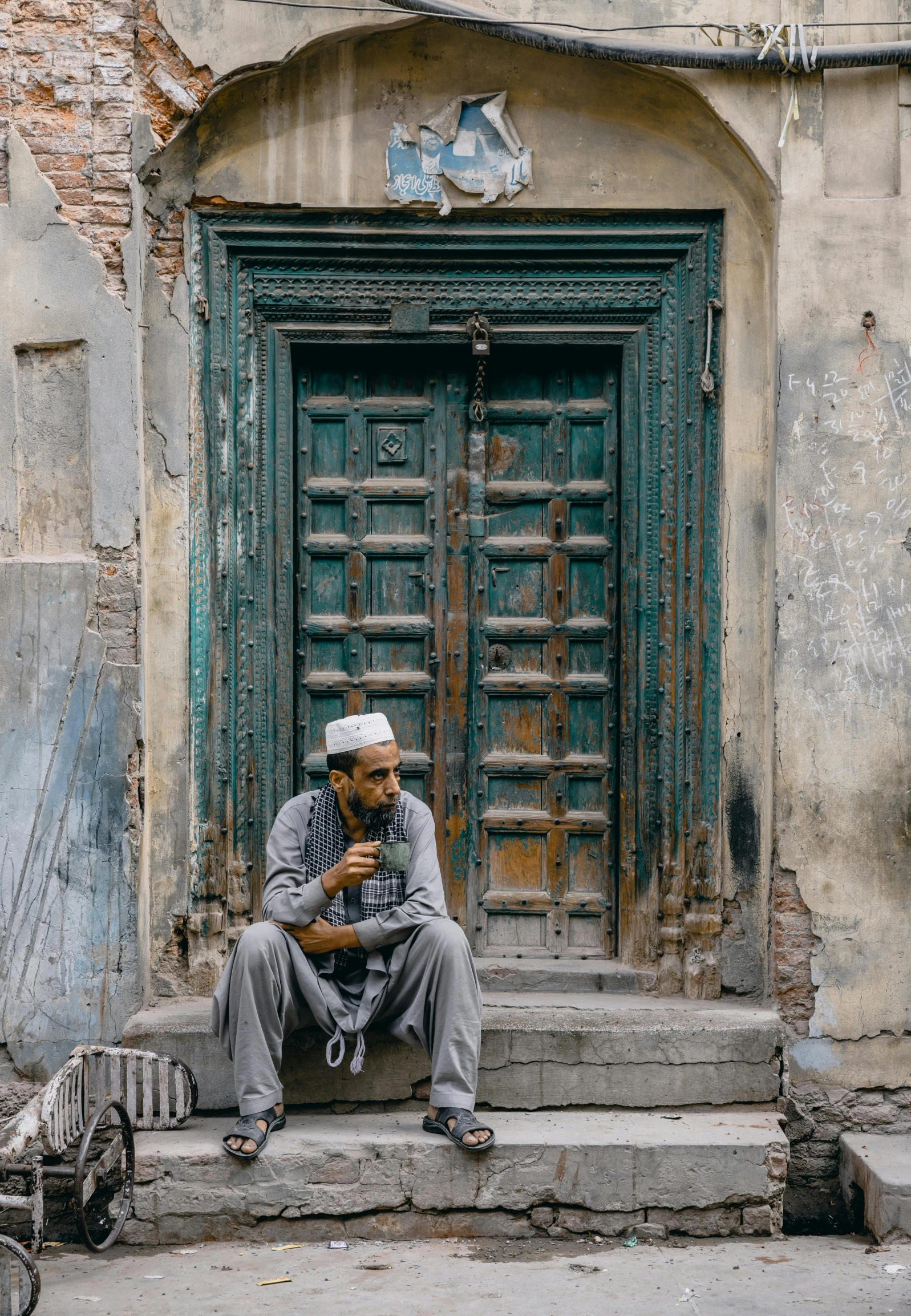 a man is sitting on steps eating a snack