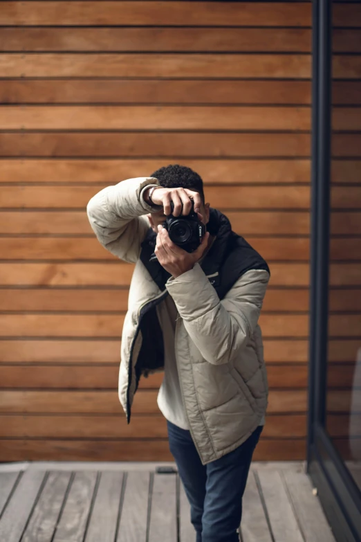 the man is taking pictures with his camera