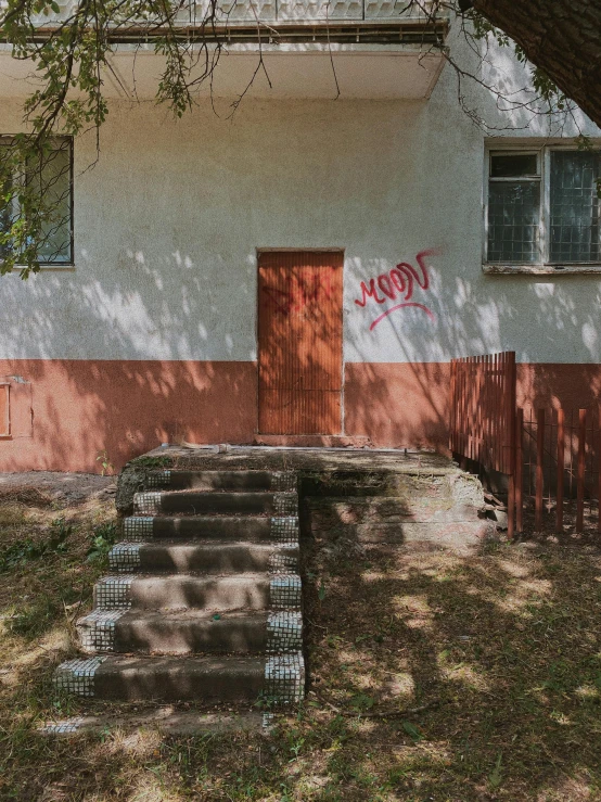 a cement wall with the words coca cola painted on it