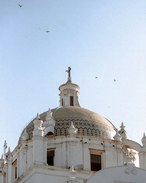 this po is looking up at the top of a church