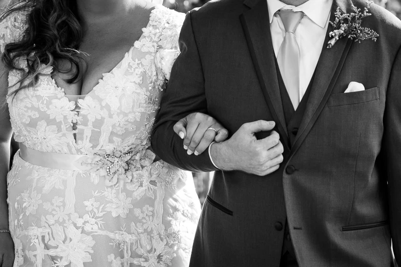 a close up of a man holding a woman's hand