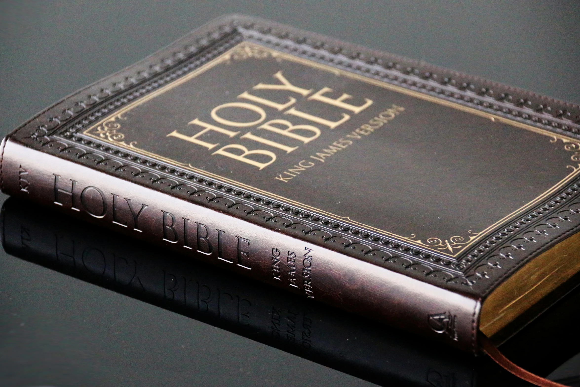 an old bible laying on top of a table