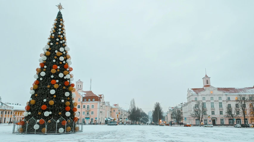 a christmas tree in the middle of a snowy area