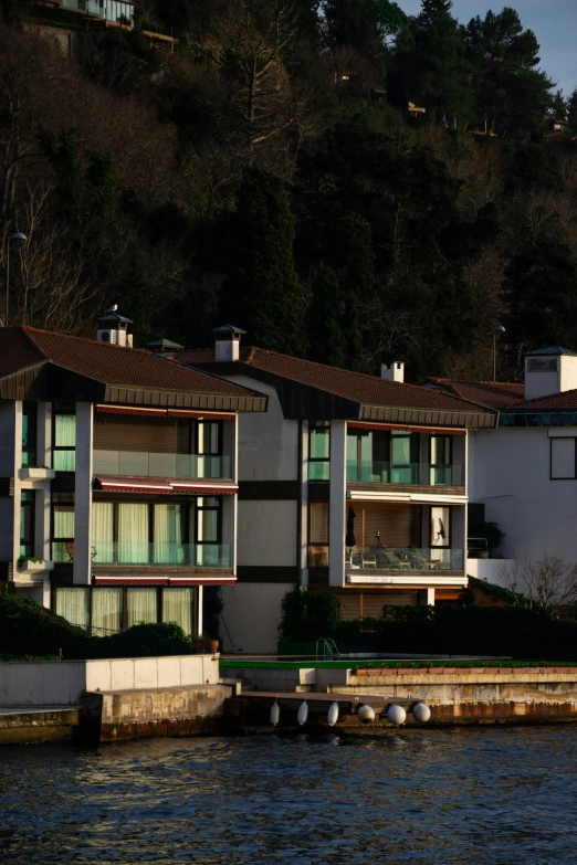 a row of buildings next to the water