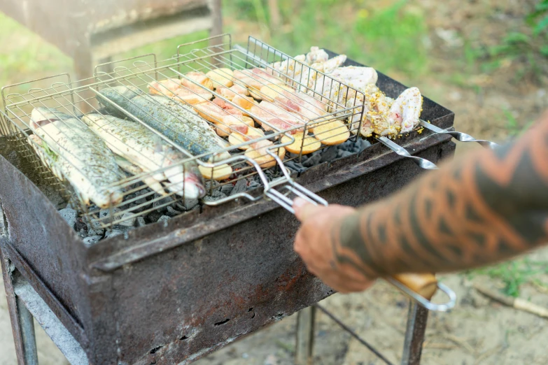 this is a grill being used by someone cooking food