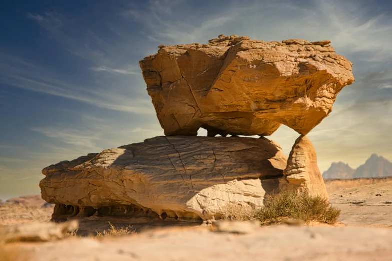 a rock formation sitting on top of another rock