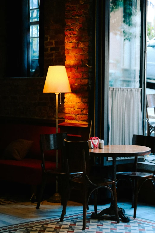 an empty dining room with a sofa, table and chairs