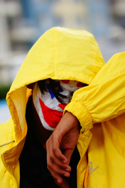 a man with his face painted and yellow