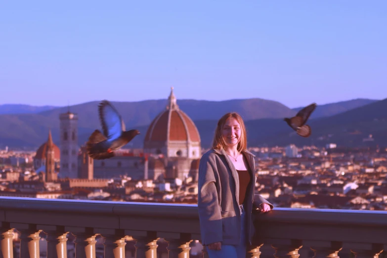 a woman with a flock of birds flying over the city