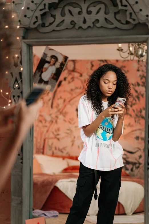 a person taking a po of herself in front of mirror