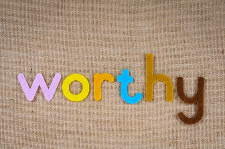the word worry spelled out of colored wood letters